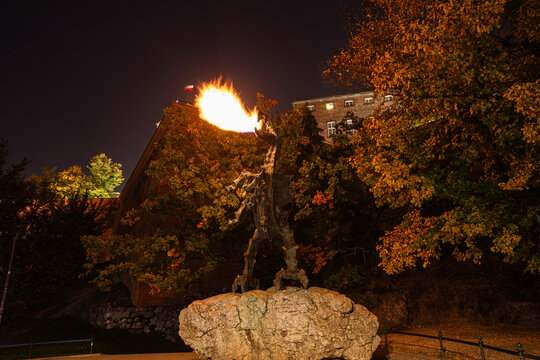 Wawel Dragon Statue breathing fire at the foot of the Wawel Hill. The statue was designed by the Polish sculptor Bronislaw Chromy and installed in 1972.
