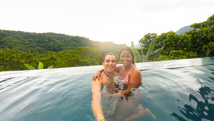 Couple at the pool enjoying their trip to Minca Colombia