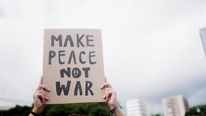 People protest against Israel and Palestine war in the city - Demonstrators fighting for freedom and peace holding banners outdoor