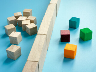 Wooden cubes and blocks. Barrier to Entry market concept.