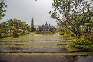 A Buddhist temple in the evening in the rain. The Brahmavihara-Arama temple has beautiful gardens...