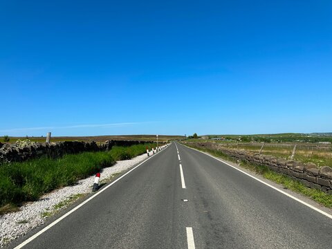 View on, Otley Road, as it crosses the moors, and reservoirs near, Hawksworth, Leeds, UK