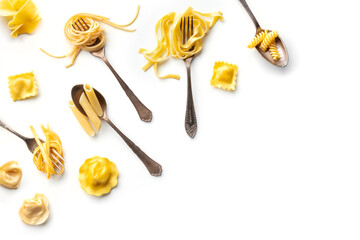 Various pasta forks. Spaghetti, fusilli, penne and other shapes of pasta, overhead flat lay shot on...
