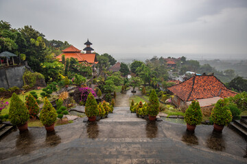 A Buddhist temple in the evening in the rain. The Brahmavihara-Arama temple has beautiful gardens...