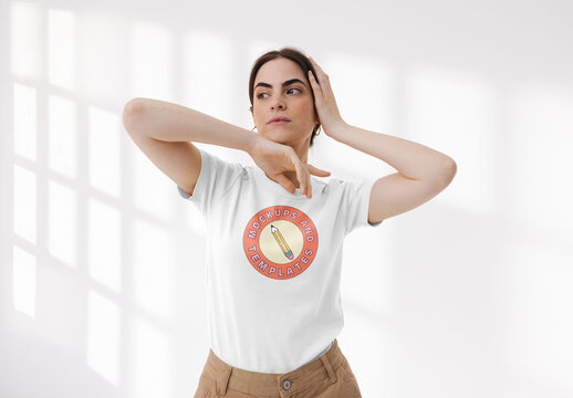 Mockup of young woman wearing customizable t-shirt, touching face