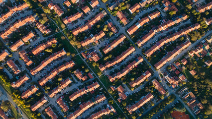 Aerial view of suburban houses in new modern development area. Thousands of houses aerial birds eye view suburb housing development new neighborhood in Europe modern architecture and design - obrazy, fototapety, plakaty