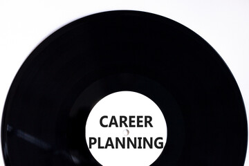 Career planning symbol. Concept words Career planning on beautiful black old retro vinyl disc. Beautiful white table white background. Business, motivational career planning concept. Copy space.