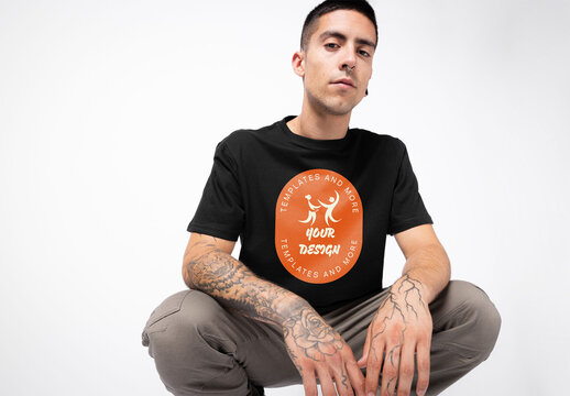 Mockup of young man wearing customizable t-shirt with tattoos