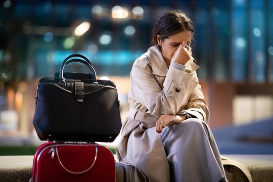 Businesswoman sitting at the airport lounge, missed flight