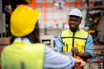 Young male engineer in metal sheet factory Responsible work is being inspected at the actual work site