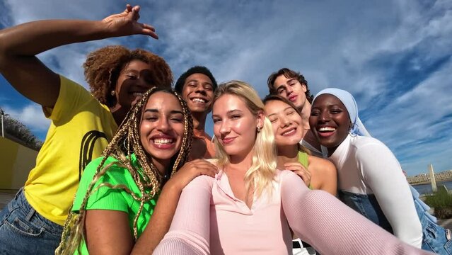 young gen z and millenial generation group selfie outdoors in summer