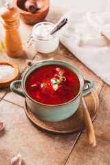 Traditional Ukrainian beet soup - borscht on the table vertical photo