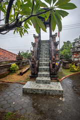 A Buddhist temple in the evening in the rain. The Brahmavihara-Arama temple has beautiful gardens and also houses a monastery. Tropical plants near Banjar, Bali