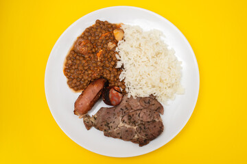 grilled meat, sausage, lentils and boiled rice