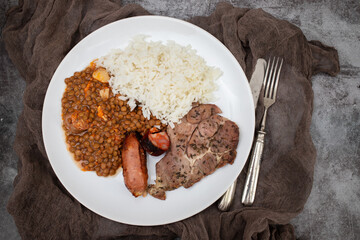 grilled meat, sausage, lentils and boiled rice
