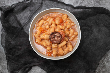 typical portuguese dish dobrada with beans in ceramic bowl