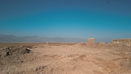 Dallol Desert Salt Canyon, Danakil Depression, Ethiopia.  Aerial view of cliff ravine and birds. Cinematic drone footage going forward in between cliffs. Famous adventure travel destination.