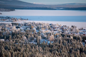 Gordijnen Winter landscape of the town of Jukkasjarvi, Sweden. Situated in the north of Sweden in Kiruna municipality. © Adam