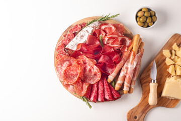 Obraz premium Charcuterie board. Antipasti appetizers of meat platter with salami, prosciutto crudo or jamon and olives