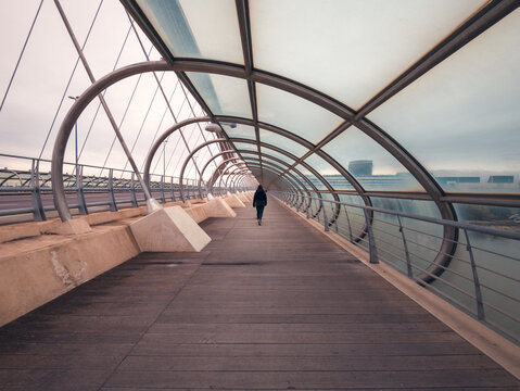 Woman Walking On Third Millennium Bridge In Zaragoza