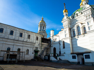 Temples, churches of Kyiv Pechersk Lavra, Kyiv, Ukraine. Sunny day. Historical and cultural reserve, historic architecture, downtown of Kyiv. 