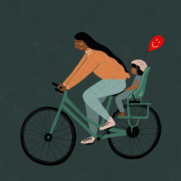 Woman cycling with child and balloon
