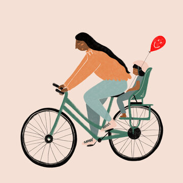 Woman cycling with child and balloon