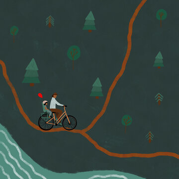 Man cycling with child and balloon in forest