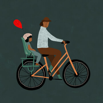 Man cycling with child and balloon
