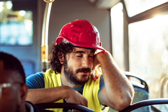 Construction worker taking a moment of rest during his commute