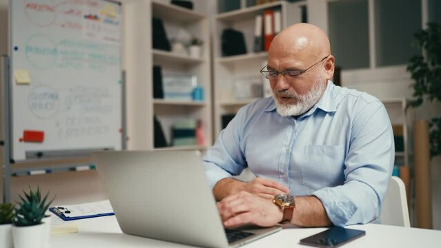 Businessman feeling stomachache while working, suffering from food poisoning