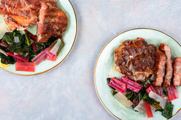 Roast meat steak with a vegetable garnish.
