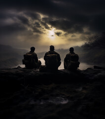 Three soldiers sitting and resting overlooking a lake on a dark evening