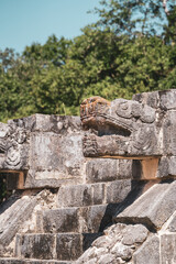 Large snake head sculptures at Chichen Itza Archaeological Zone.