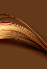 Abstract glow backgound. Gold (bronze) paper wave on brown background.