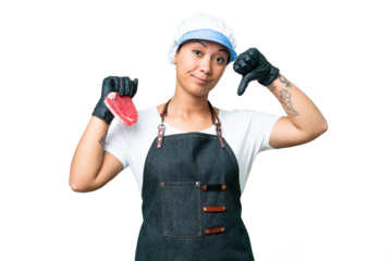 Butcher woman wearing an apron and serving fresh cut meat over isolated chroma key background showing thumb down with negative expression