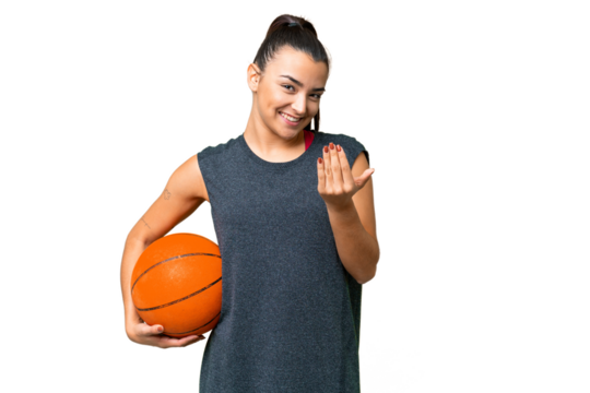 Young beauty woman over isolated chroma key background playing basketball and doing coming gesture