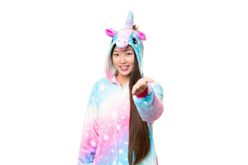 Young Asian woman with unicorn pajamas over isolated chroma key background shaking hands for closing a good deal