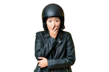Young Asian woman with a motorcycle helmet over isolated chroma key background surprised and shocked while looking right