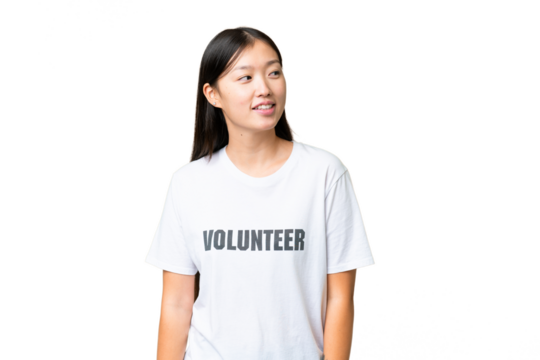 Young volunteer woman over isolated chroma key background looking to the side and smiling - Powered by Adobe