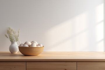 A wooden bowl of eggs on a kitchen counter.