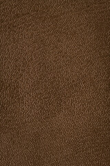 Closeup detail on brown leather texture background