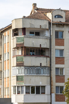 Old apartment block from communist era in Eastern Europe. Communist socialist architecture style flat. Dreary and depressive rust-eaten building.
