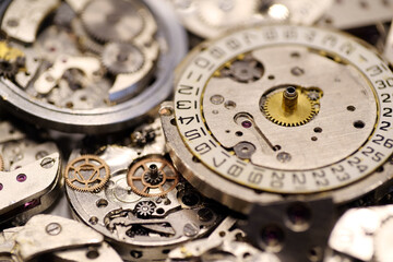 Old mechanical watches with gears and cogs. Watch or clock mechanisms