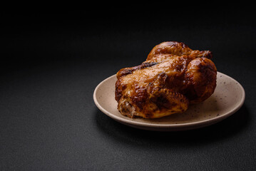 Crispy delicious whole baked chicken with vegetables, salt and spices