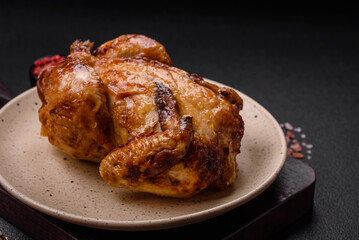 Crispy delicious whole baked chicken with vegetables, salt and spices