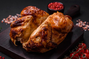 Crispy delicious whole baked chicken with vegetables, salt and spices