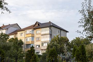 Old apartment block from communist era in Eastern Europe. Communist socialist architecture style flat. Dreary and depressive rust-eaten building.