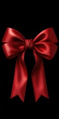 Naklejka premium A simple yet elegant red bow placed on a contrasting black background. Perfect for adding a touch of sophistication to any project or design