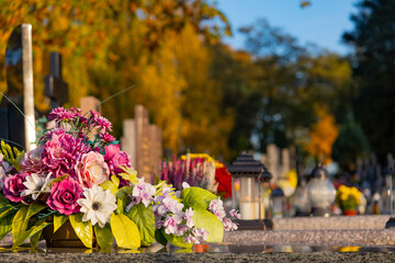 Fototapeta na wymiar Flowers in the cemetery in Poland 